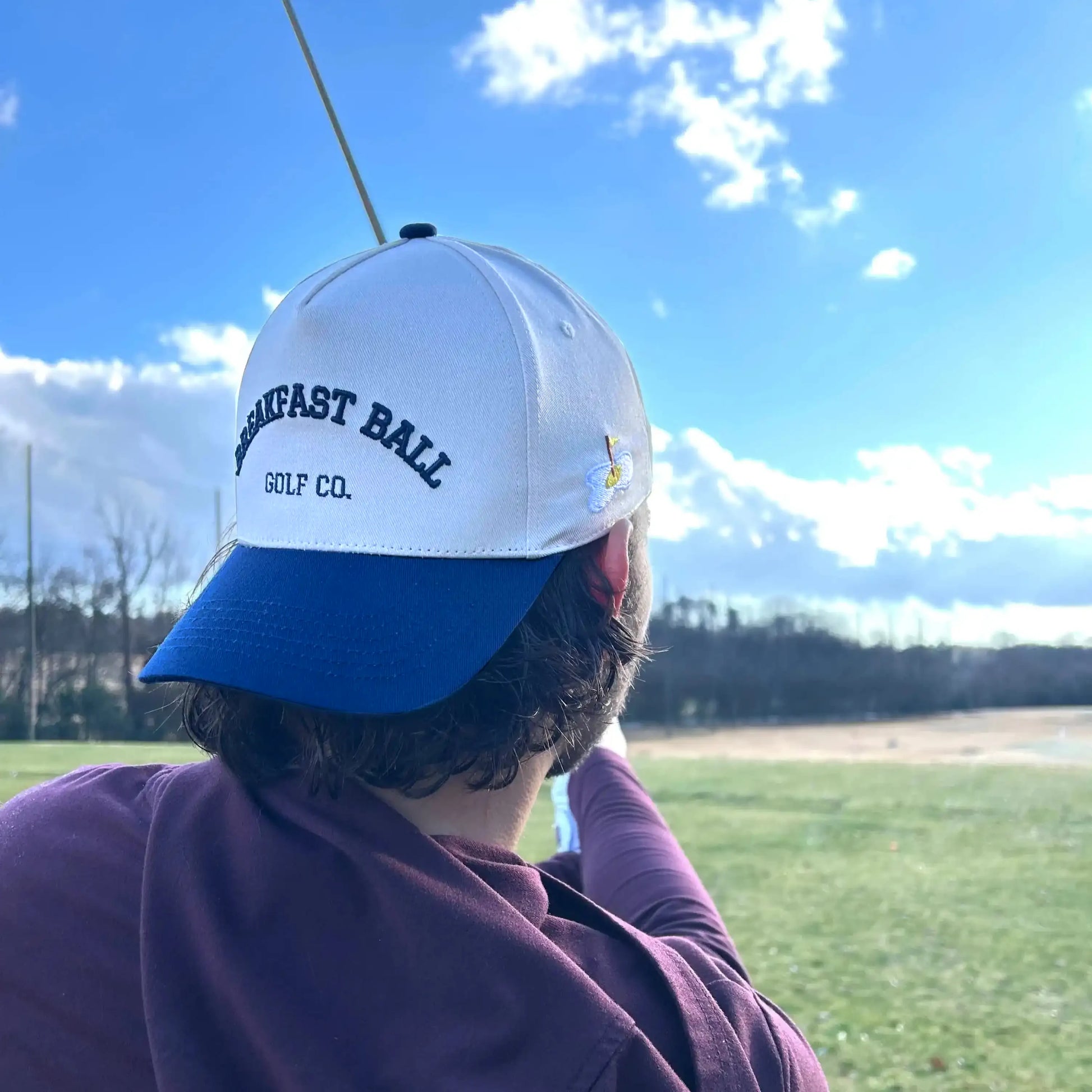 man swinging golf club