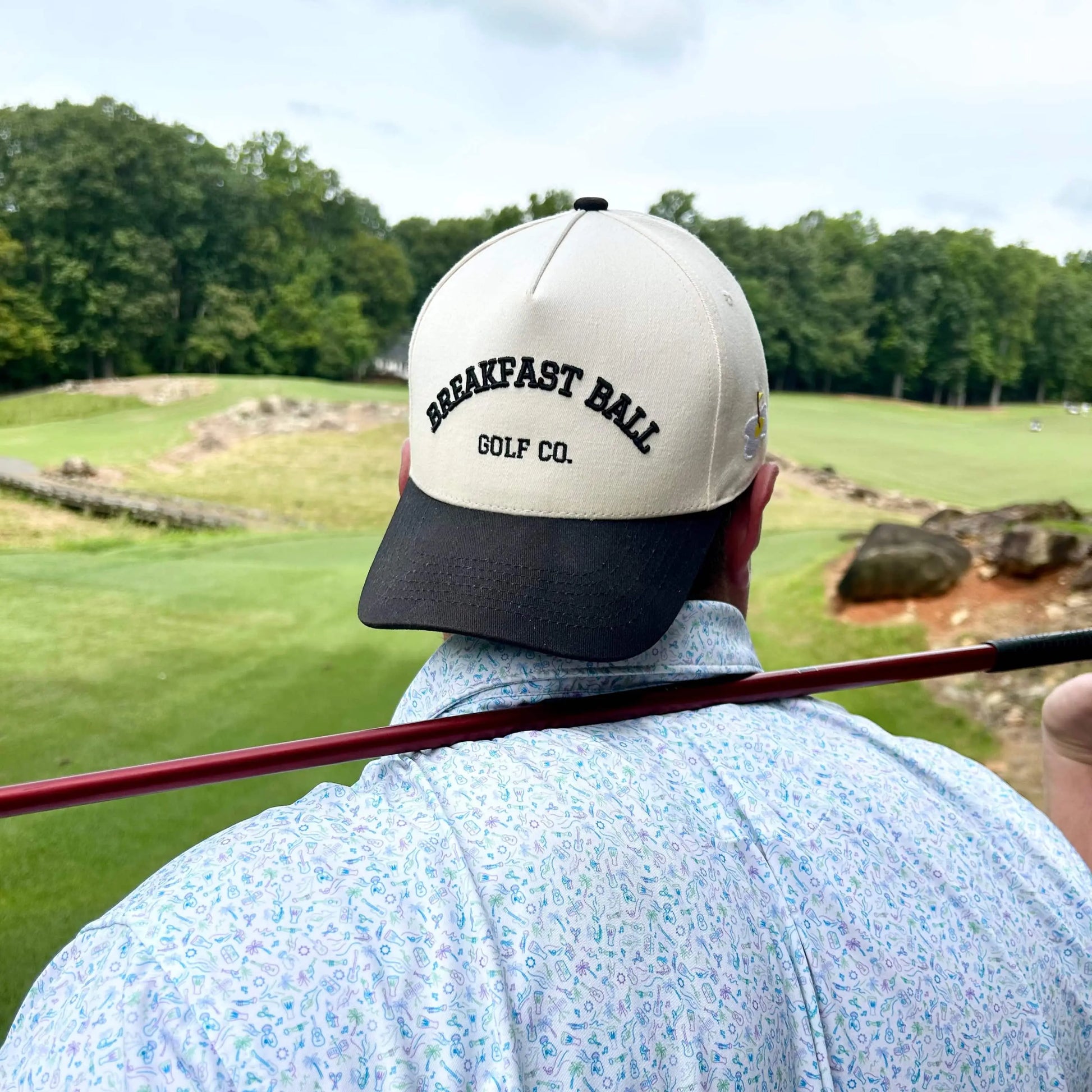 man in golf hat