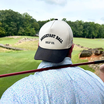 man in golf hat