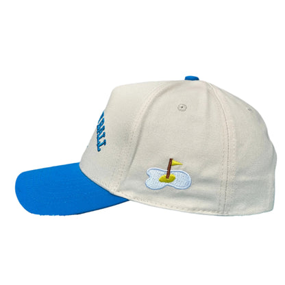 side of blue golf hat